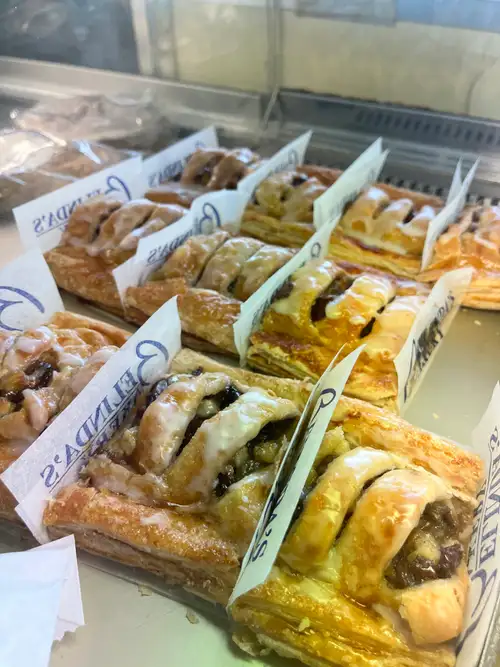 Floral decorated cakes displayed on vintage stands